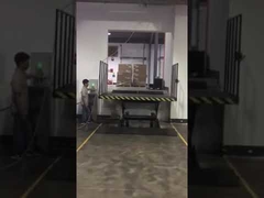 Table élévatrice hydraulique à ciseaux fixe avec alimentation électrique installée à la zone de chargement